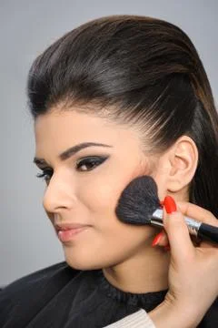 Applying perfect makeup Foto stock