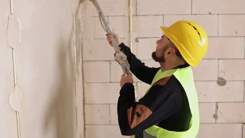 Applying plaster, spray plaster, construction tools Stock Footage 328916002