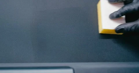 Applying Protective Cleaner to Car Trunk Mat 1 Stock Footage 293920830