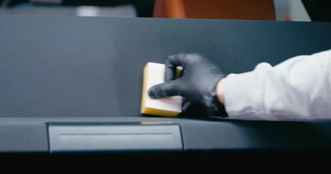 Applying Protective Cleaner to Car Trunk Mat 2 Stock Footage 293920841