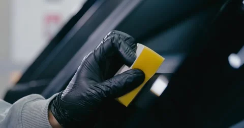 Applying Protective Cleaner to Car Trunk Mat 6 Stock Footage 293921110