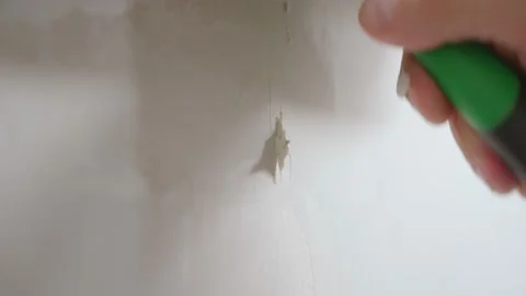 Applying putty to the wall with a spatula Stock Footage 163294618