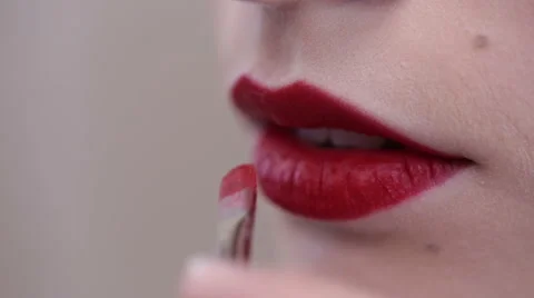 Applying red lipstick Stock Footage 60998821