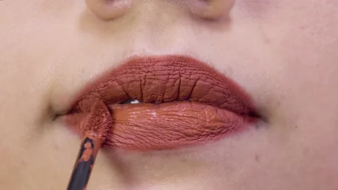 Applying Red Lipstick Stock Footage 131559320