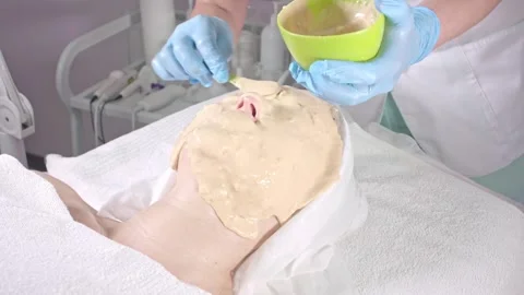 Applying Rejuvenating Face Mask for Spa Treatment Stock Footage 305605348