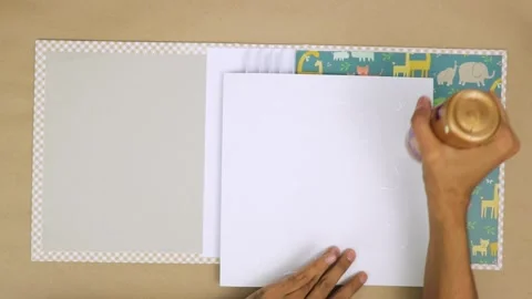 Applying right type of glue to secure decorative elements in a baby Stock Footage 280971424