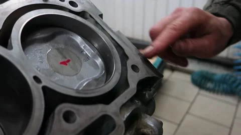 Applying the sealant to the surface of the engine cylinder block Stock Footage 150266688