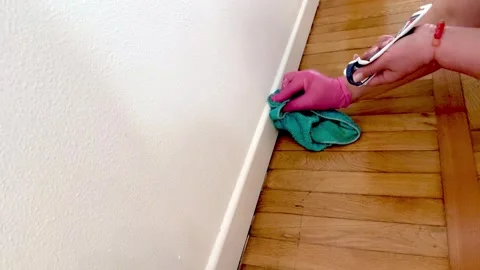 Applying Silicone Sealant to Baseboard During Home Repair. Stock Footage 332741875
