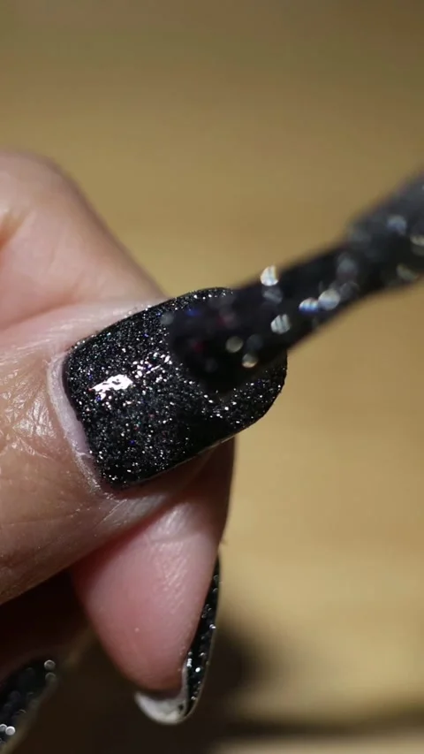 Applying Sparkly Nail Polish Sequence Stock Footage 306130568