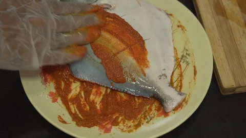 Applying Spices on Pomfret Fish 4K Part1 Video stock 120725166
