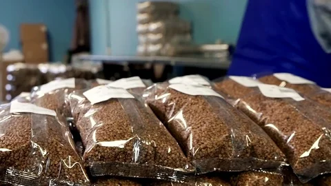 Applying stickers on packages with buckwheat Stock-Footage 82904641