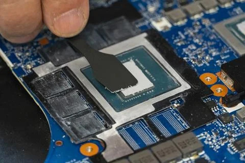 Applying Thermal Paste on Computer CPU Stock Photos