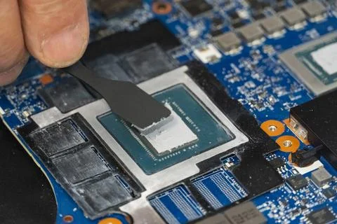 Applying Thermal Paste on Computer CPU Stock Photos