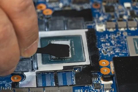 Applying Thermal Paste on Computer CPU Stock Photos