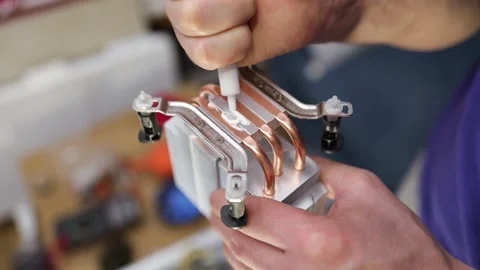 Applying thermal paste to a computer processor from AMD cpu, replacing paste Stock Footage 262674267