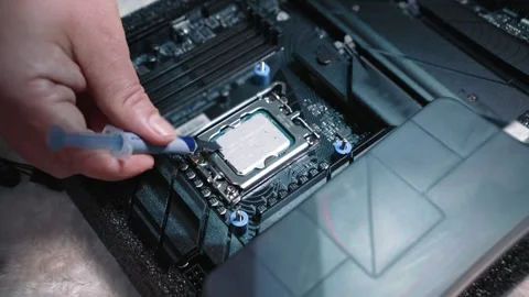 Applying thermal paste to CPU using syringe Stock Footage 324592447