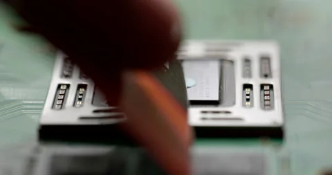 Applying thermal paste to a processor, replacing thermal paste on a GPU Stock Footage 156418439