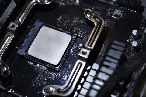 Applying thermal paste to the surface of the computer processor. Thermal in.. 写真素材