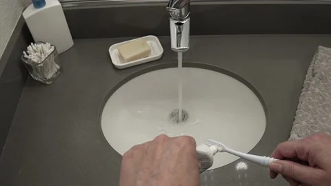 Applying Toothpaste to a Toothbrush Video stock 158191140