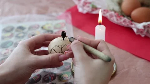 Applying Wax Pattern on Ukrainian Pysanka Egg Stock Footage 339296710