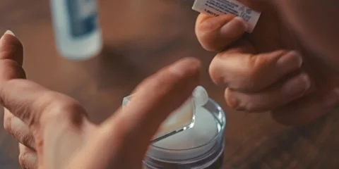 Applying white nail polish to your nails at home Stock Footage 293893029