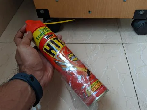 Applyling HIT under the table, helps to kill the cockroach 写真素材
