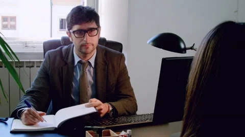 Appointment between an italian business man or lawyer and a client in his office Stock Footage 59139378