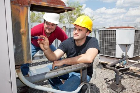 Apprentice Air Conditioning Repairman Stock Photos
