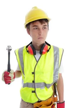 Apprentice builder or carpenter looking sideways Young apprentice builder ... 스톡 사진