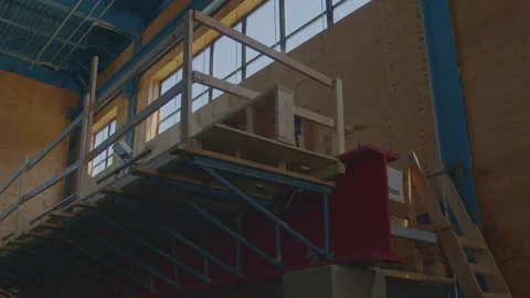 Apprentice Carpenters Demonstrate Indoor Timber Beam Bridge Construction on Stock Footage 309615554