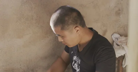 Apprentice hammering looking down near window Stock Footage 141364155