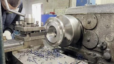 Apprentice mastering lathe operations in workshop 스톡 동영상 285365034