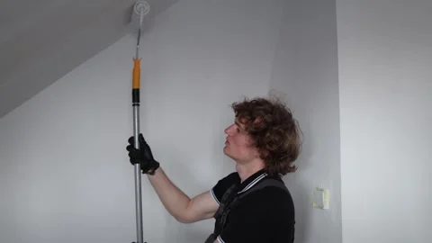 Apprentice painter learning renovation work Video stock 335045898