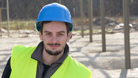 Apprentice standing on construction site Stock Footage 123215332