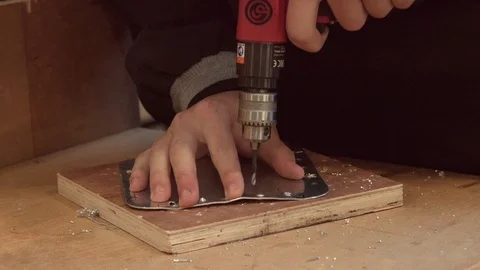 Apprentice using an electronic screwdriver (close up, slow mo) Stock Footage 127033922