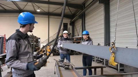 Apprentice working in steelworks plant, with instructor Stock Footage 123231440