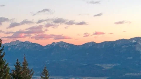 In the approach, large mountains above the mountains, a play of yellow-orange Stock Footage 256648031