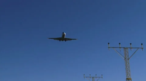 Approach lighting system ALS + descending airplane KLM  F70 - overhead shot Stock Footage 39619659