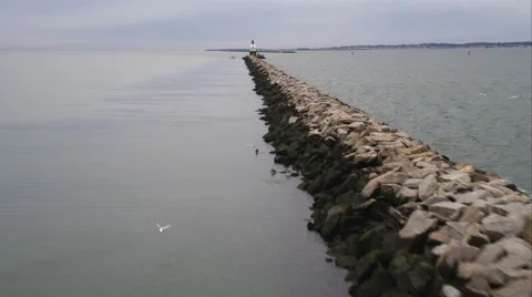 Approach up long jetty to lighthouse in harbor at New Haven, Connecticut. Shot Stock Footage 59169862
