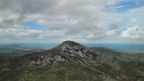 Approach Mountain summit for coastline reveal Stock Footage