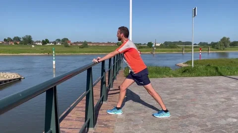 Approach of standing cool down stretching exercising of male trail runner 스톡 동영상 238051338