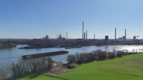 Approach toward harbor structures with barges at sunrise Stock Footage 331205327
