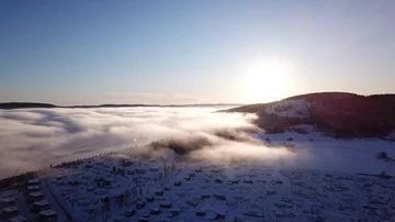 Approaching aerial shot over the clouds and fjord in Drammen, Norway Stock Footage 85819326