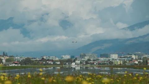 Approaching aircraft in Austrian Alps Stock Footage 270064374