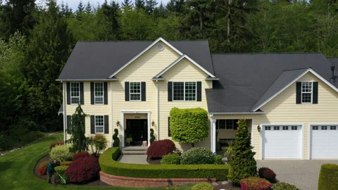 Approaching and flying over a modern American luxury suburban home Stock Footage 219655098