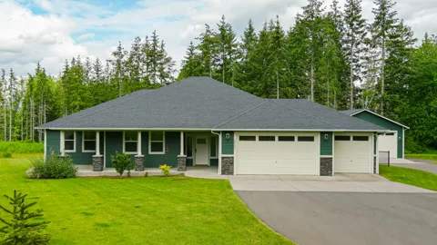Approaching and flying over modern home in the forest Stock Footage 304767701