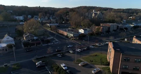 Approaching and flying over veterans boulevard in Bristol CT in sideways aerial Stock Footage 82326130