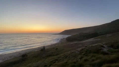Approaching a beach on a sunset in Cornwall England Stock Footage 251305929