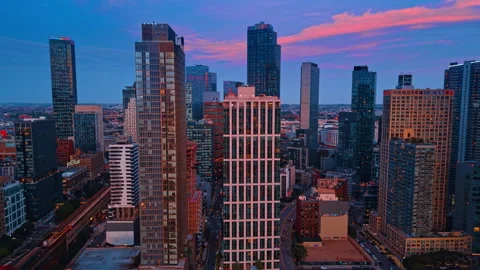 Approaching beautiful high-rises in New York City, USA. Long cloud in blue sky Stock Footage 340281124