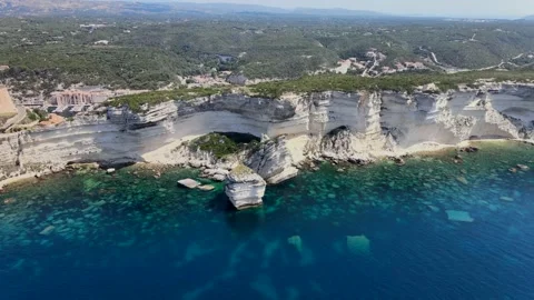 Approaching a big rock under an high cliff Stock Footage 138323957